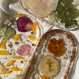 Resin trinket tray featuring real preserved flowers, handcrafted by Happihome for stylish keepsake and décor use.