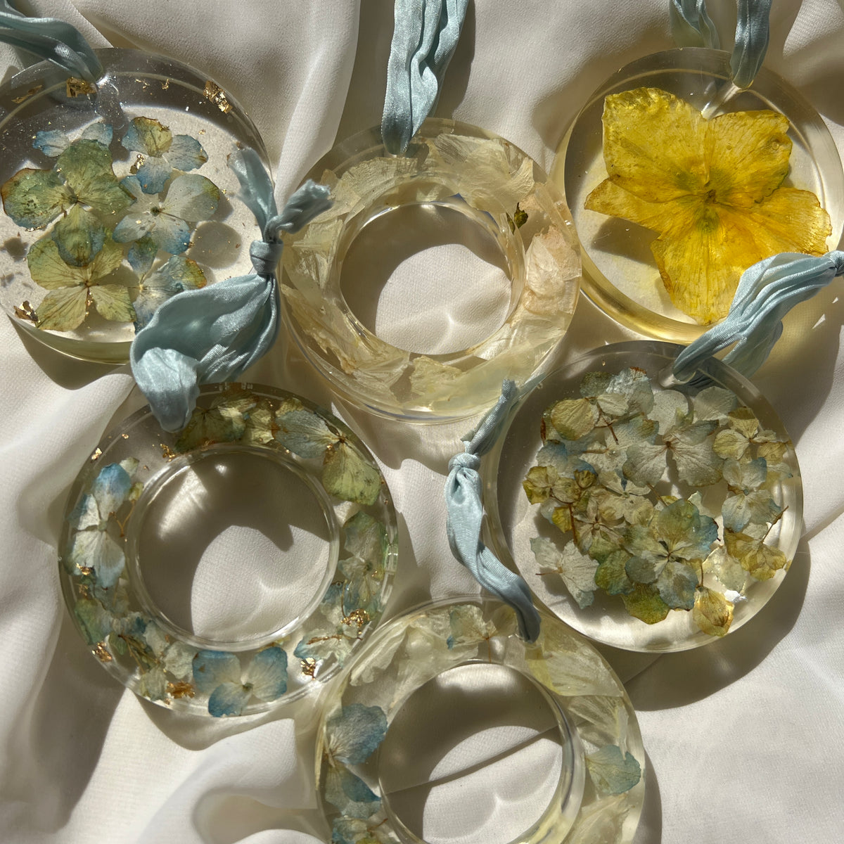Set of six handcrafted resin Christmas ornaments with preserved flowers, designed by Happihome for elegant holiday décor.