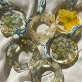 Set of six handcrafted resin Christmas ornaments with preserved flowers, designed by Happihome for elegant holiday décor.
