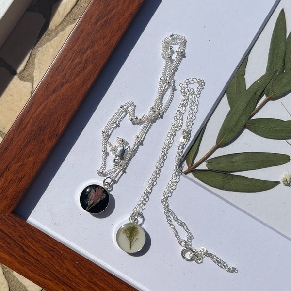 Sterling silver pendant necklace in round shape featuring preserved flowers, handcrafted by Happihome as a delicate floral keepsake.