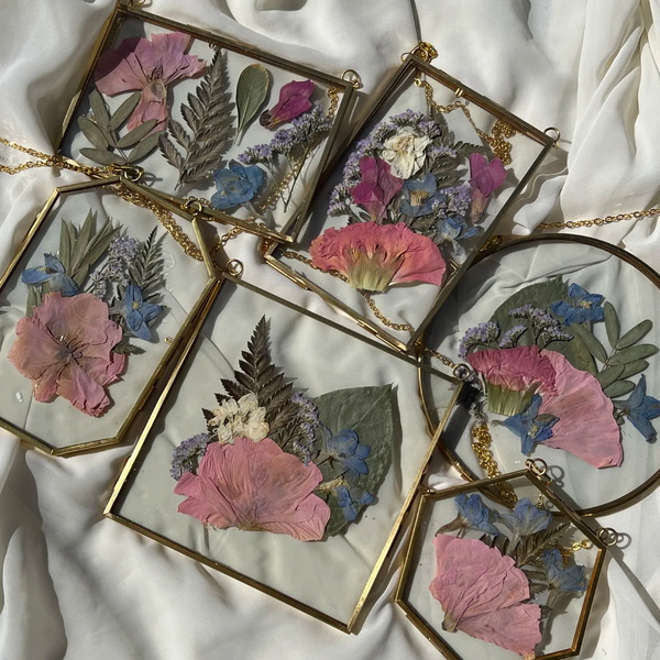 Brass hanging flower frame displaying preserved blooms, handcrafted by Happihome for timeless floral wall décor.
